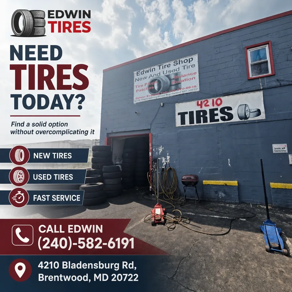 Exterior of Edwin Tire Shop in Brentwood, MD with stacked tires, open service bay, signs and tools visible.