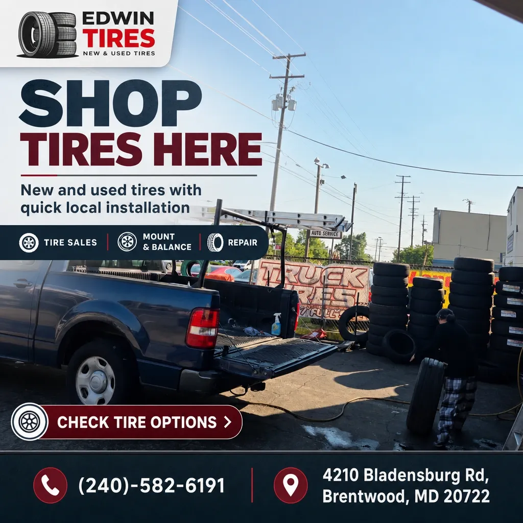 Exterior of Edwin Tires lot with pickup truck, stacked tires, and a technician handling a tire, promoting local tire sales and installation