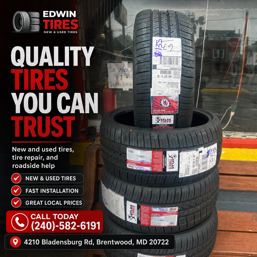 Stack of labeled new tires in front of Edwin Tires shop window, promotional text and contact banner visible.